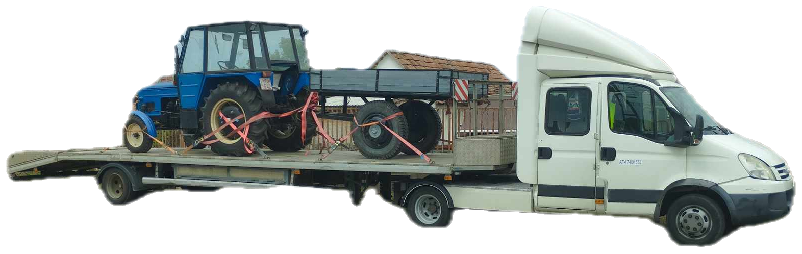 Iveco Daily nyerges vontató platós trélerrel, rajta traktor